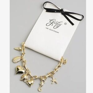 702. 18k gold dipped sea charm bracelet